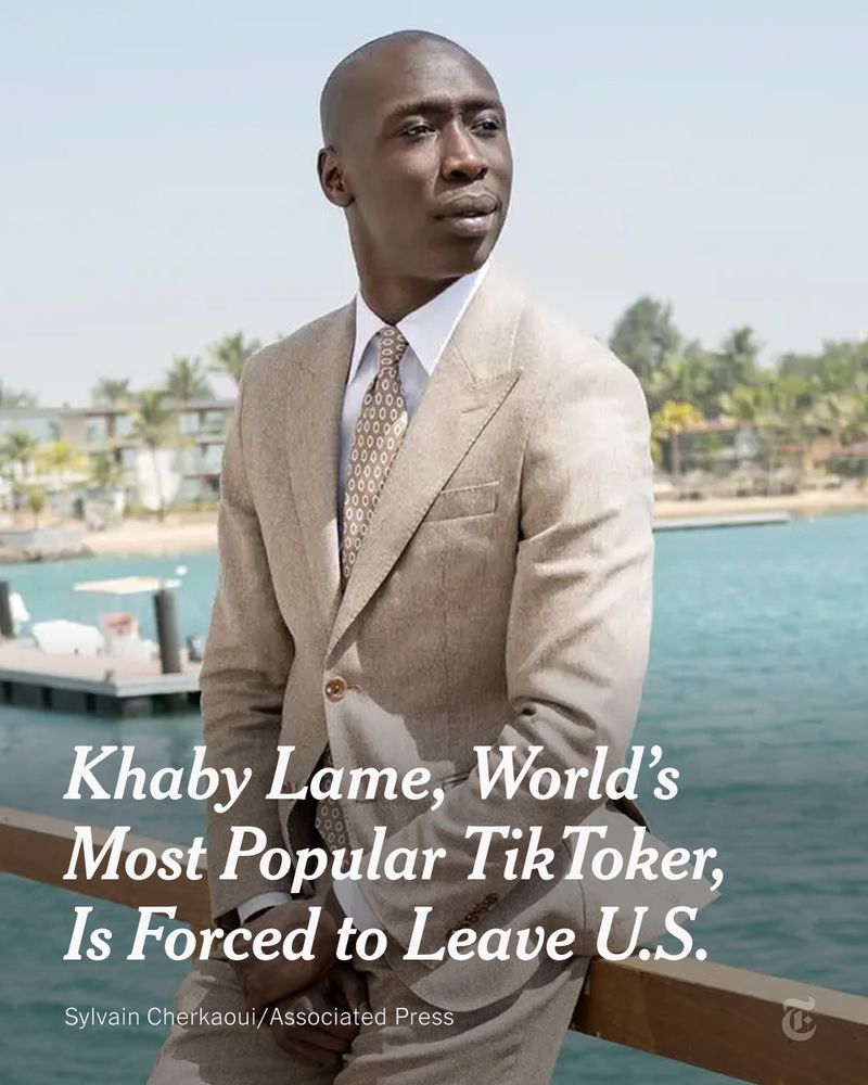 Khaby Lame in a tan suit leans against a railing overlooking a harbor. A headline reads: “Khaby Lame, World’s Most Popular TikToker, Is Forced to Leave U.S.” Photo credit: Sylvain Cherkaoui/ Associated Press.