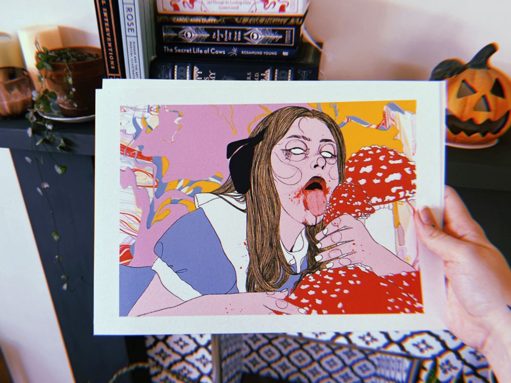 a drawing of alice in wonderland licking mushrooms behind held in front of a fireplace with a pumpkin, books, plants and candles on it 