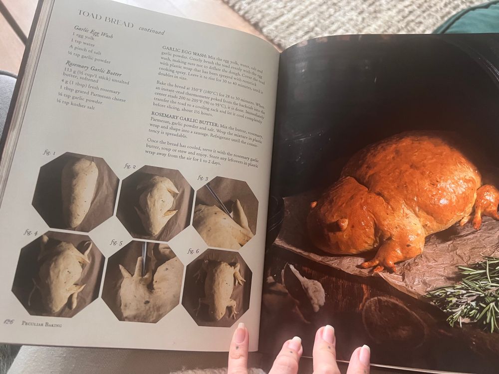 a recipe book open on a page on how to make a toad shaped loaf of bread 