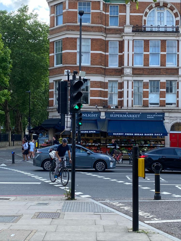 Picture of cars blocking cycle lane with green cycle signal