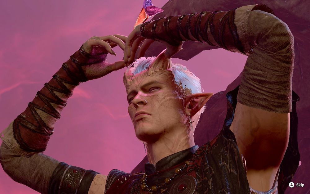 a man mimics a crown atop his head with his hands