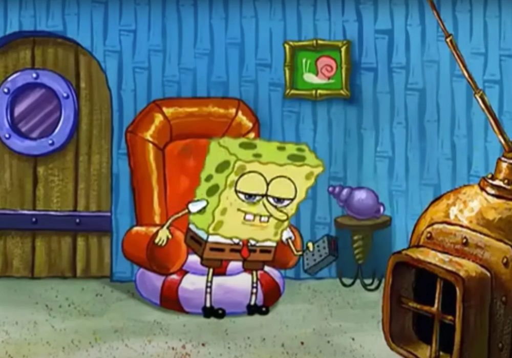 spongebob getting out of his chair looking very tired