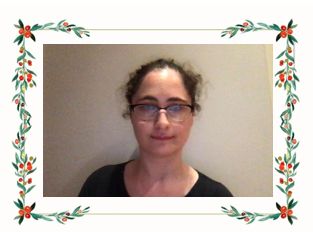 headshot of a woman in glasses and black top.