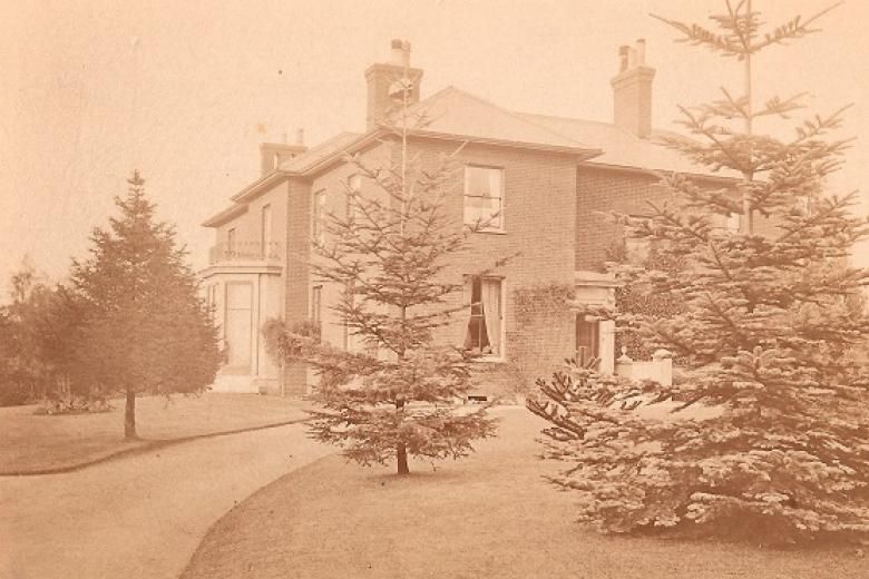 A Victorian villa with several trees around it - the original base of Girton College.