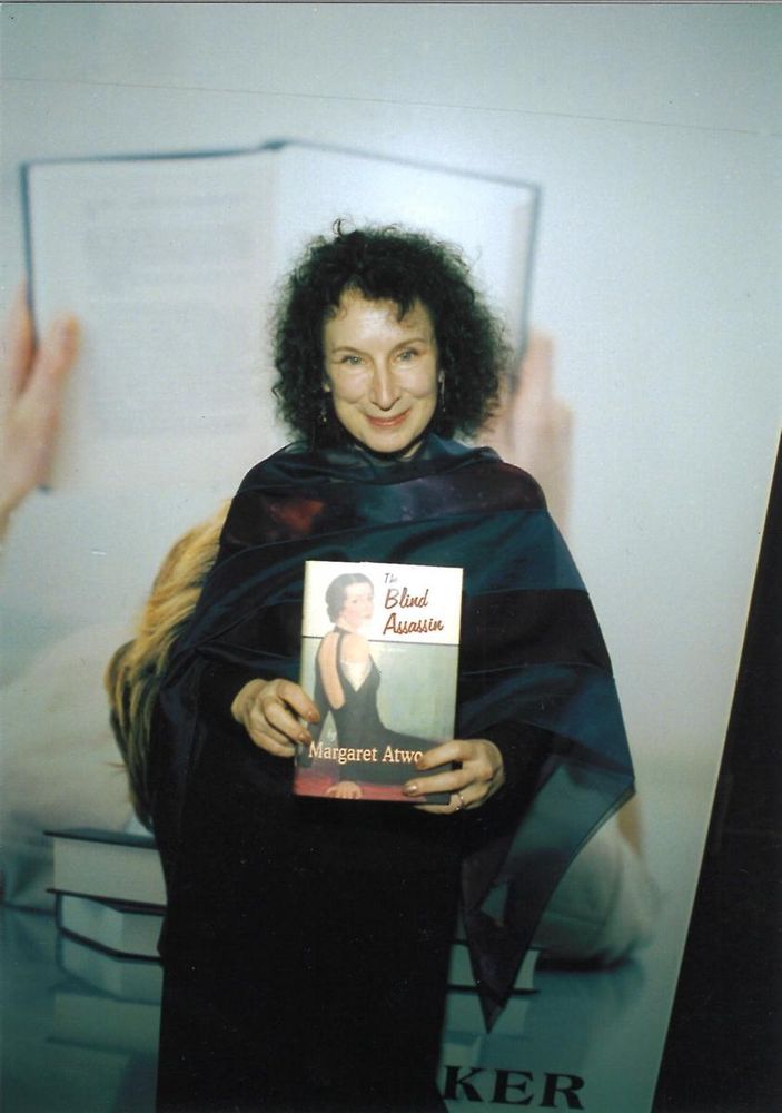Margaret Atwood holding a copy of The Blind Assassin after winning the Booker in 2000.

