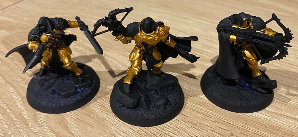 The Emberwatch Warband with gold paint applied over a black undercoat