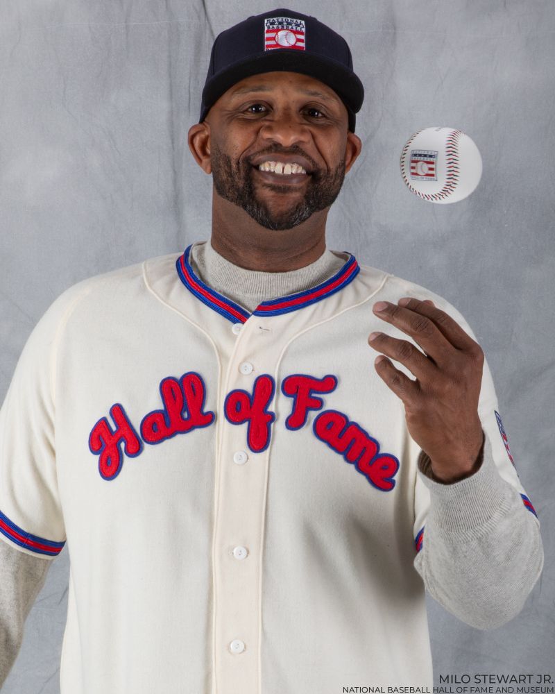 Portrait of CC Sabathia wearing a Hall of Fame jersey and cap as he tosses a Hall of Fame logo baseball in his left hand. (Milo Stewart Jr./National Baseball Hall of Fame and Museum)