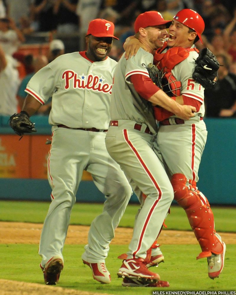Carlos Ruiz embraces Roy Halladay with Ryan Howard close behind as the Phillies celebrate Halladay's perfect game on May 29, 2010. (Miles Kennedy/Philadelphia Phillies)