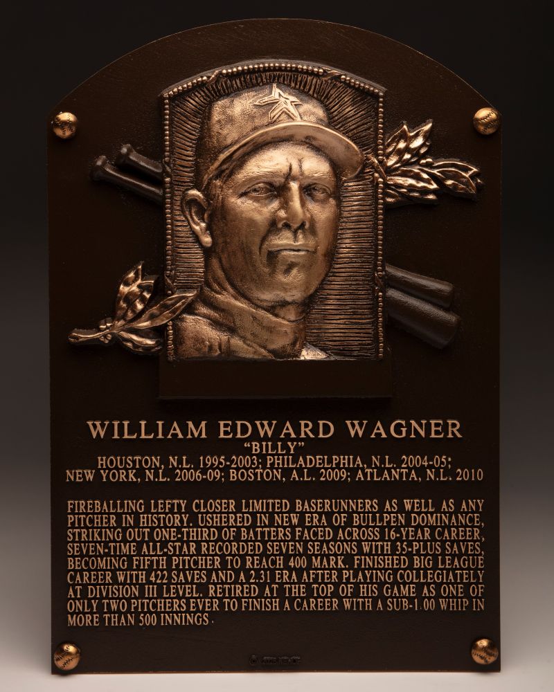 WILLIAM EDWARD WAGNER
“Billy”
Houston, N.L. 1995-2003; Philadelphia, N.L. 2004-05;
New York, N.L. 2006-09; Boston, A.L. 2009; Atlanta, N.L. 2010

Fireballing lefty closer limited baserunners as well as any pitcher in history. Ushered in new era of bullpen dominance, striking out one-third of batters faced across 16-year career, seven-time All-Star recorded seven seasons with 35-plus saves, becoming fifth pitcher to reach 400 mark. Finished big league career with 422 saves and a 2.31 ERA after playing collegiately at Division III level. Retired at the top of his game as one of only two pitchers ever to finish a career with a sub-1.00 WHIP in more than 500 innings.
-
Photo: Milo Stewart Jr./National Baseball Hall of Fame and Museum