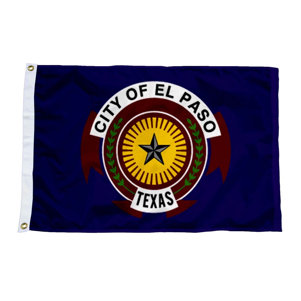 A navy blue flag with a yellow sunburst framed by green laurel branches. A blue five-pointed star is in the middle of the sunburst. White banners over and under the emblem read “City of El Paso” “Texas”