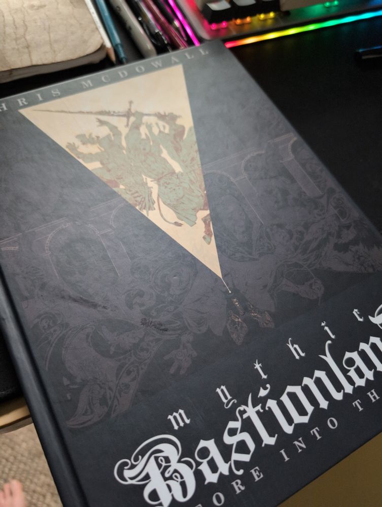 A closed copy of the RPG mythic bastionland sitting on my desk.