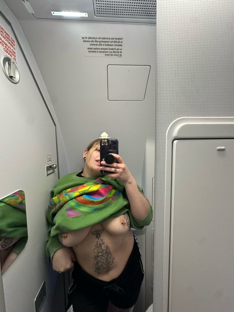 pete plays, nude, plane, airplane, travel, tattoos, piercings, curvy, titties, big boobbs