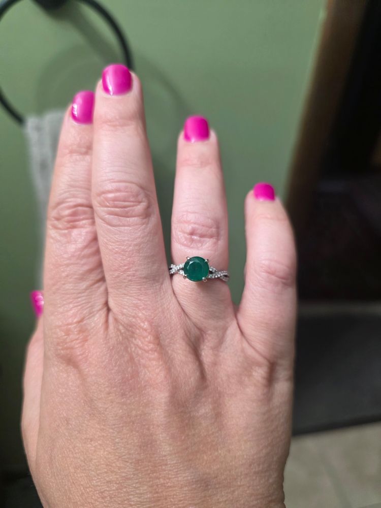 White gold pave band with 2 CT roid cut dark green emerald 