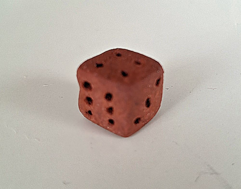 dado tipo d6 feito em cerâmica terracota pascoal, com números perfurados. monoqueima 1230 graus.