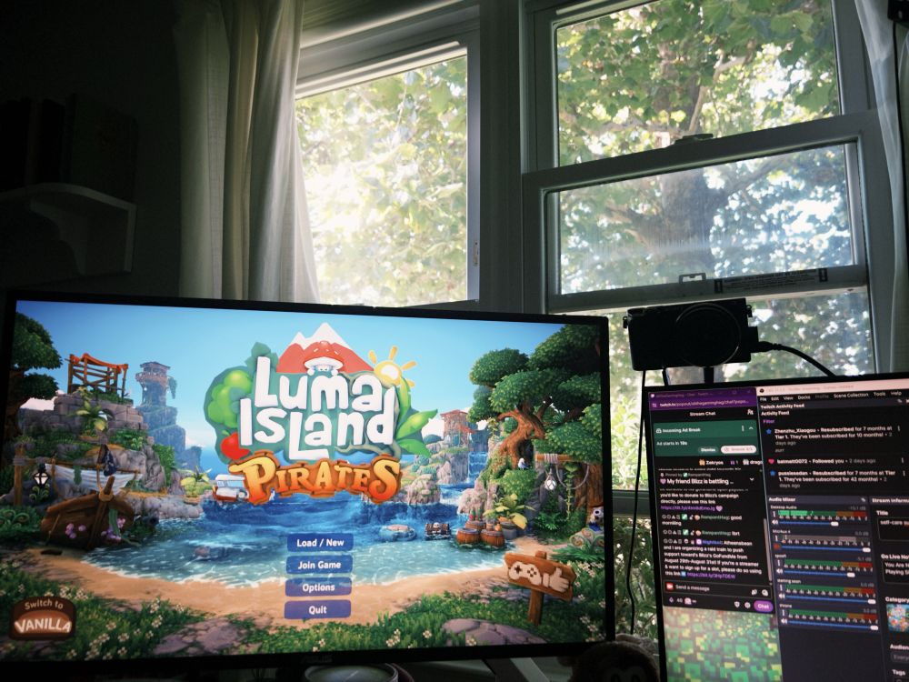 a picture of a monitor in front of a sunlit window with Luma Island open on the screen