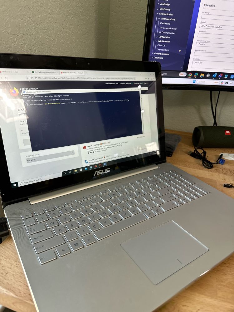 Laptop with powershell running on the screen