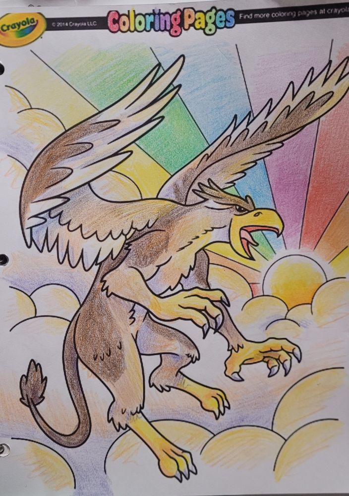 Completed colouring page of a large, brown griffin flying above the clouds, with the sun beaming a rainbow in the background.