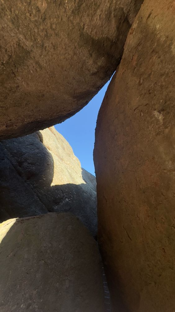 View of sky through an opening of rocks