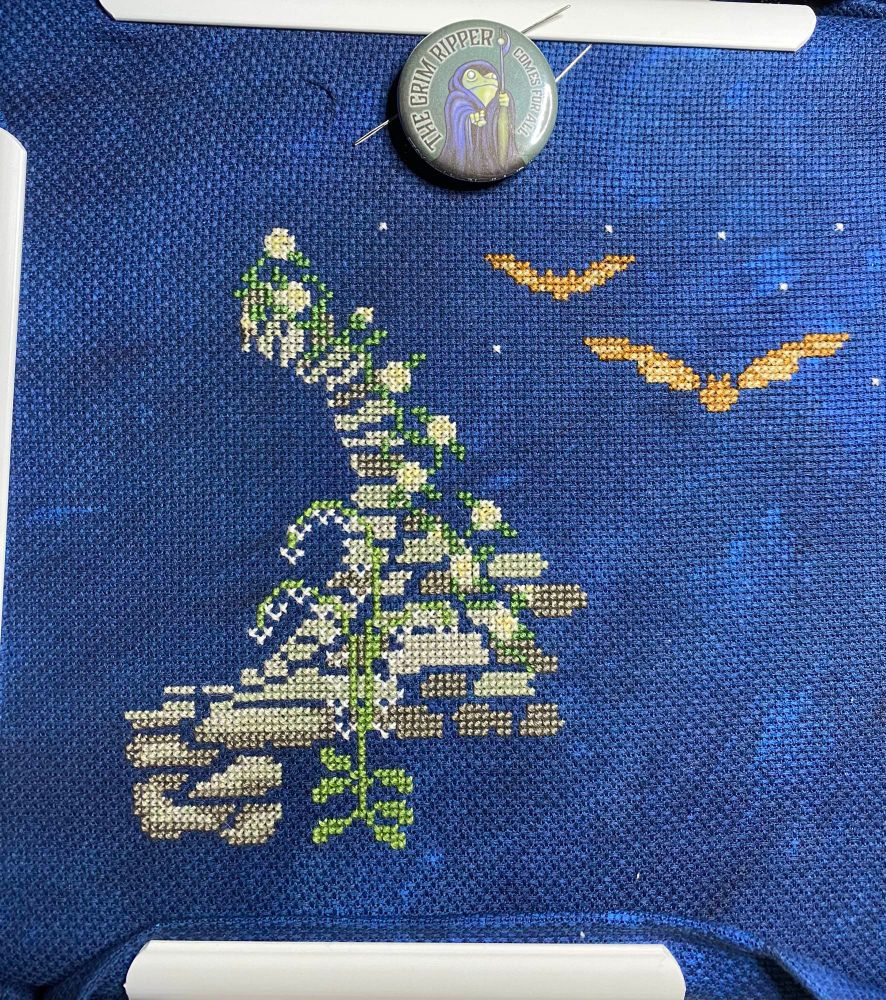 Cross-stitch WIP, parts 1-2 of the Moon Garden SAL by Witch’s Garden Crafts. Pattern is inspired by the first moon garden, Mehtab Bagh, designed as the perfect spot to view the Taj Mahal by moonlight. 

Garden wall is stitches in shades of gray and flowers completed so far are stitches in green and shades of white and yellow. Bats stitched in shades of orange-brown. Fabric is 16 ct. Aida in Starry Night, hand-dyed by Witch’s Garden Crafts. 