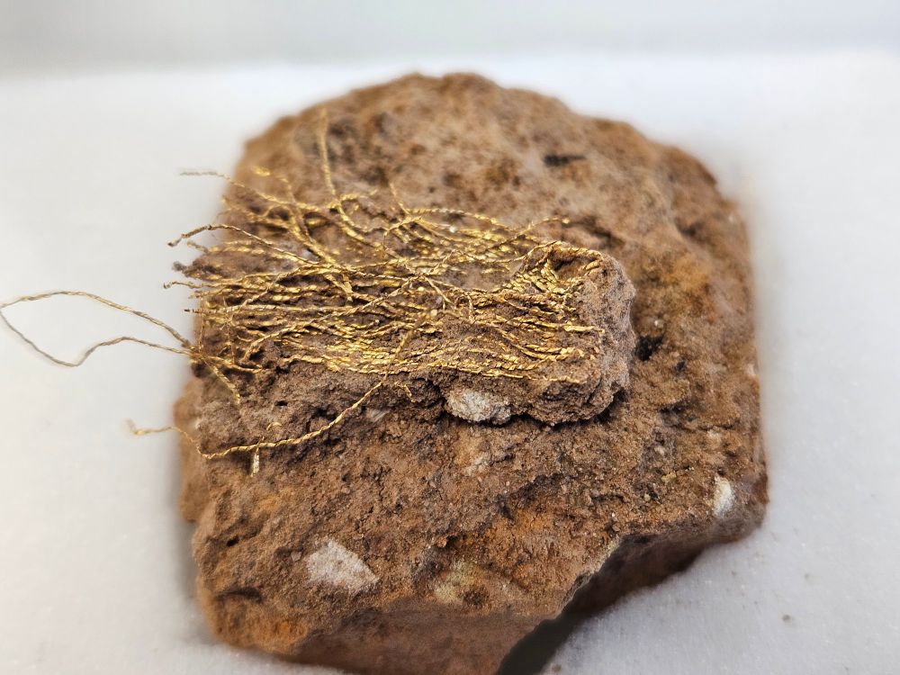 Fragments of gold thread recovered from archaeology excavation
