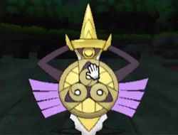 a yellow and purple shield with a hand reaching out