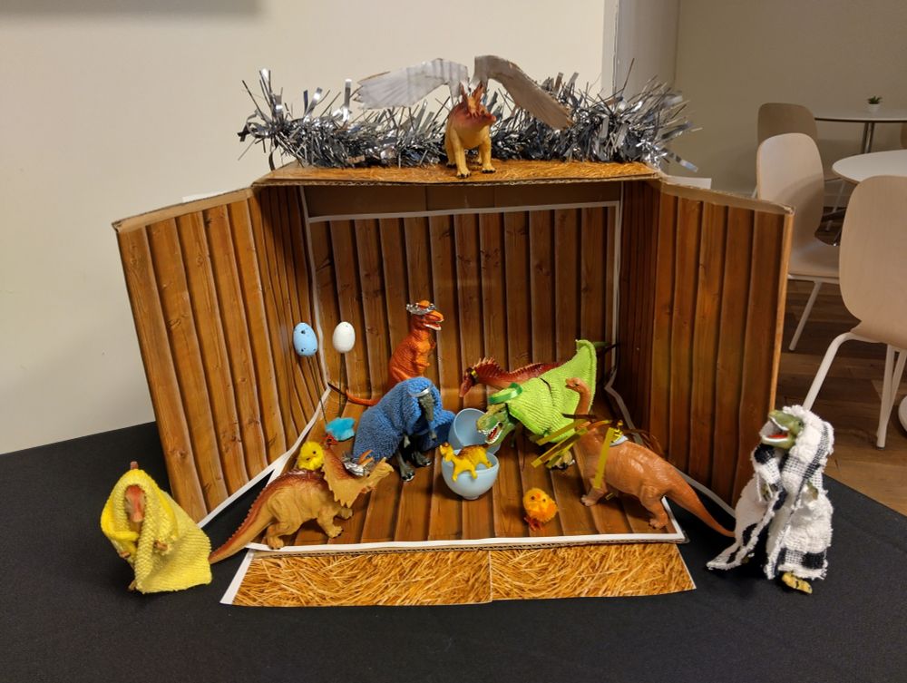 A nativity populated with dinosaurs 
