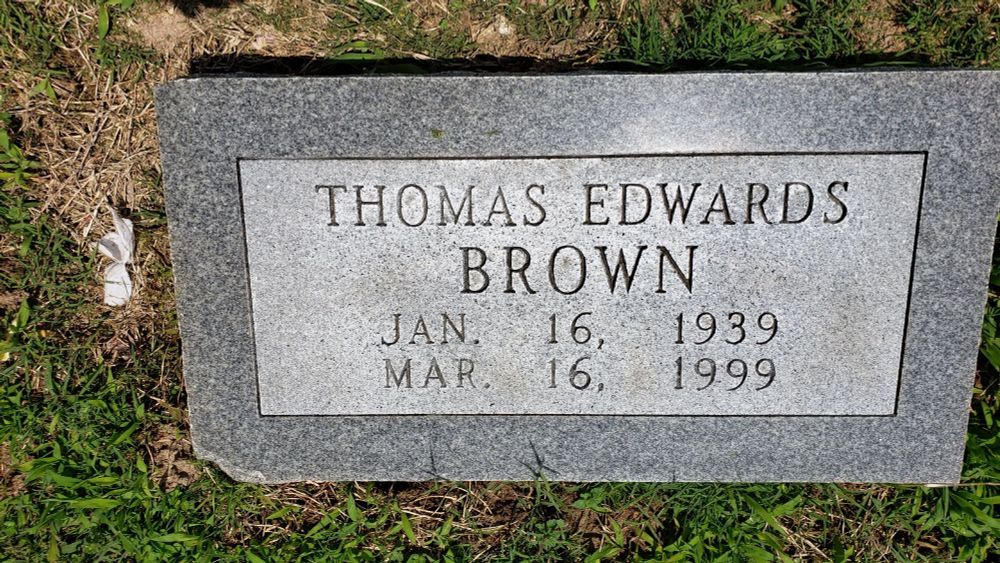 A tombstone:
THOMAS EDWARDS 
        BROWN
    Jan 16, 1939
    Mar 16, 1999