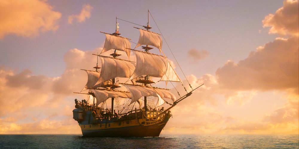 The Revenge (Our Flag Means Death) in all her magnificent glory.  A ship at sunset with clouds lit yellow, her sails unfurled. 