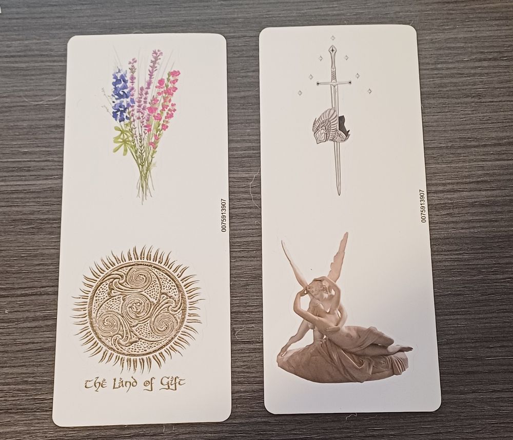 Four stickers: one with flowers of the bisexual colours, one with Númenor's sun with the inscription "the land of the gift" underneath, one with Andúril going through Aragorn's crown and with stars around it and one with Canova's Eros and Psyche statue