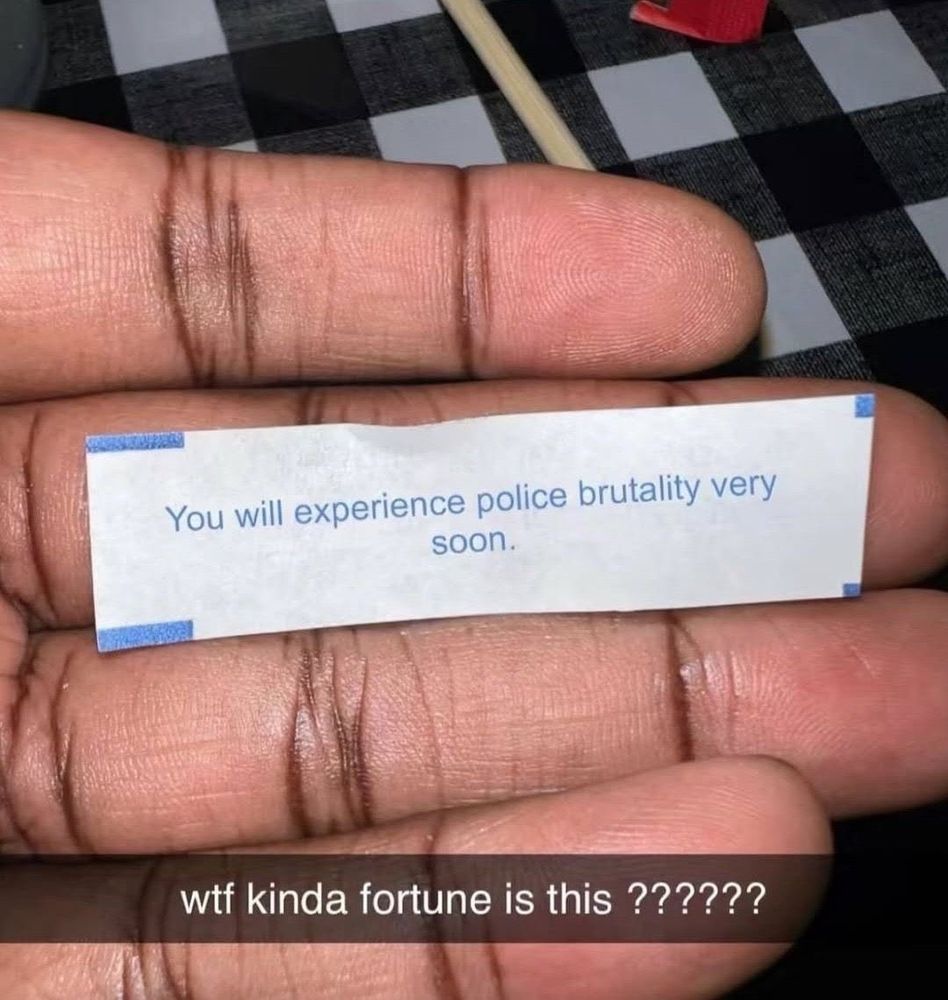 A cookie fortune paper saying "you will experience police brutality very soon"