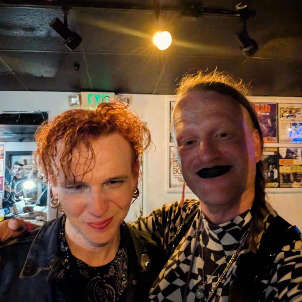 A selfie of two trans women after a punk show, OP on the right and Jenni Rose of Vandoliers on the left