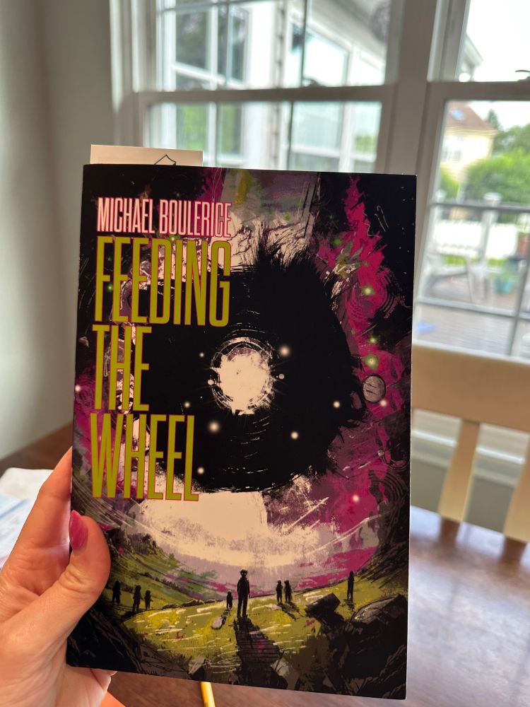 Feeding the Wheel by Michael Boulerice. A black hole in the sky surrounded by a pinkish purple. Some dark figures are standing on a green hill. The center-most figure has white eyes.