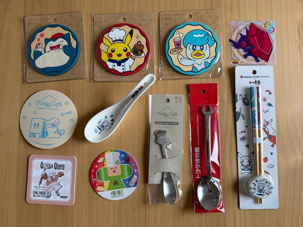 Coasters of Snorlax, Pikachu, Quaxley, Sableye, Kirby, Quina Quen and the Prince of All Cosmos. A Kirby Cafe spoon, a Toyota Museum spoon, a Pokémon soup spoon and a Pokémon pair of chopsticks.