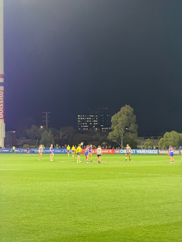 4x zoom photo of an AFLW game: The numbers on the players’ backs can be made out 