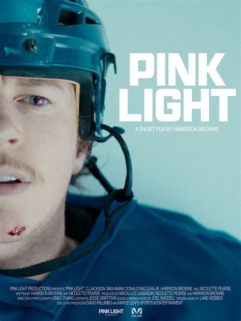 The movie poster for Pink Light. A man in a blue hockey jersey and helmet is lying on the ice with a cut on his chin. A pink light is reflected in his eye 