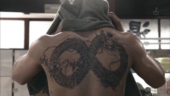 A still of his back tattoo in the Japanese drama Ouroboros