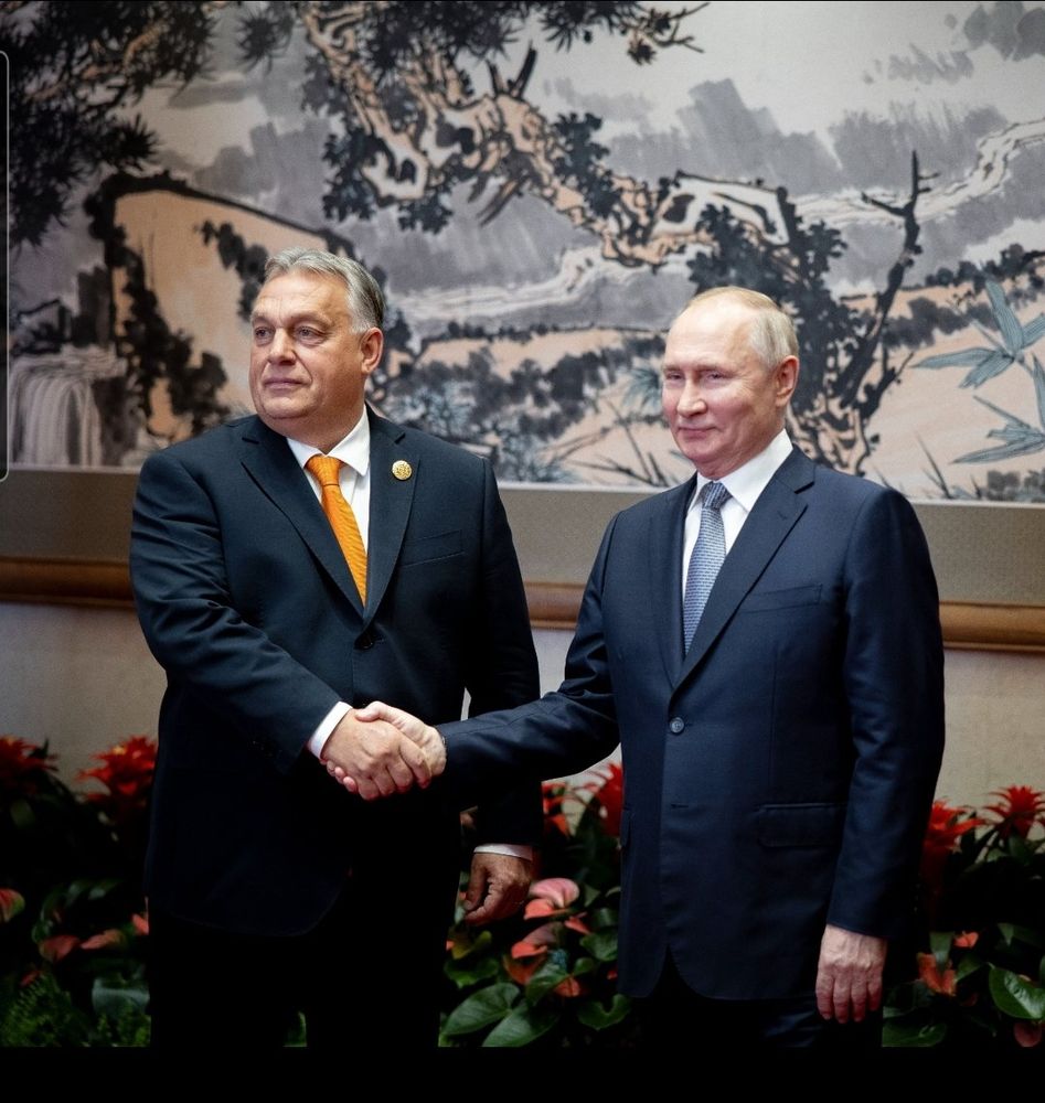 Viktor Orban, Prime Minister of Hungary, shaking hands with Vladimir Putin, Dictator of the Russian Federation.