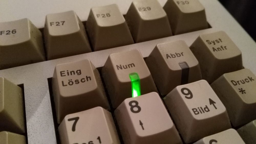 Green LED on NUM lock key.