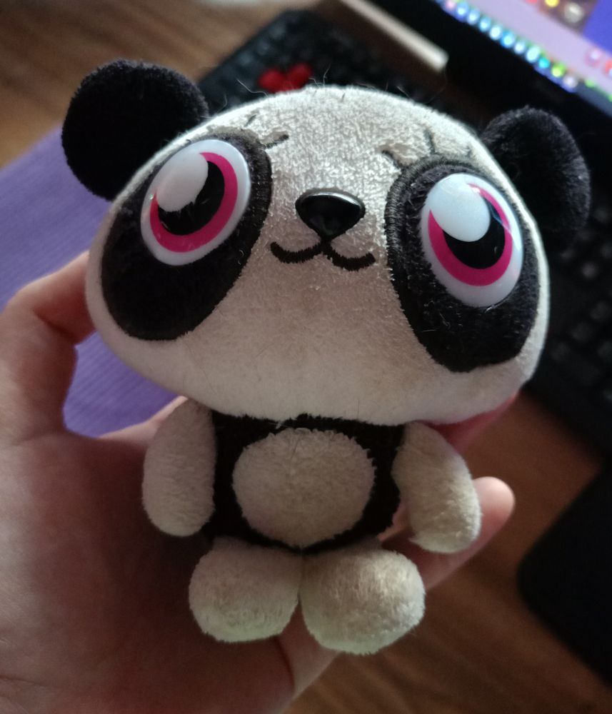 a worn plushie of Shishi from Moshi Monsters