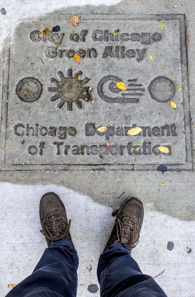 Green alley sidewalk sign