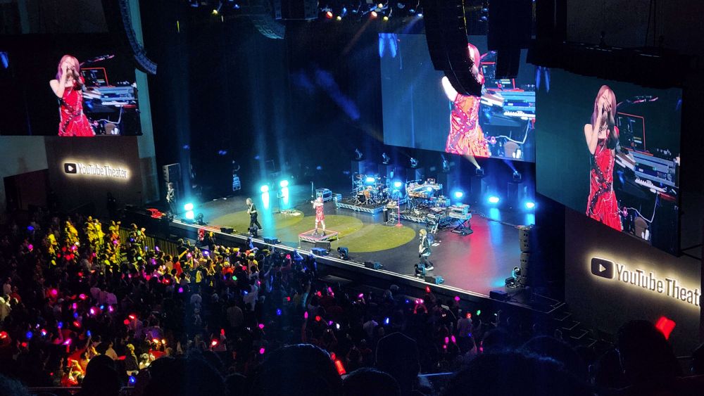 A wide view of Japanese pop rock artist, LiSA, performing at the YouTube theater in Los Angeles