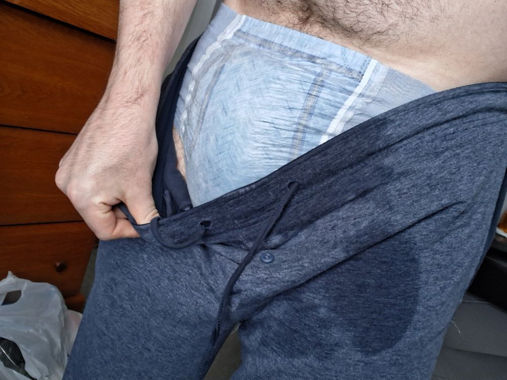 A closef photo of me, this time pulling down the front of my pants to show off the source of thosexwet spots, my completely soggy goodnite