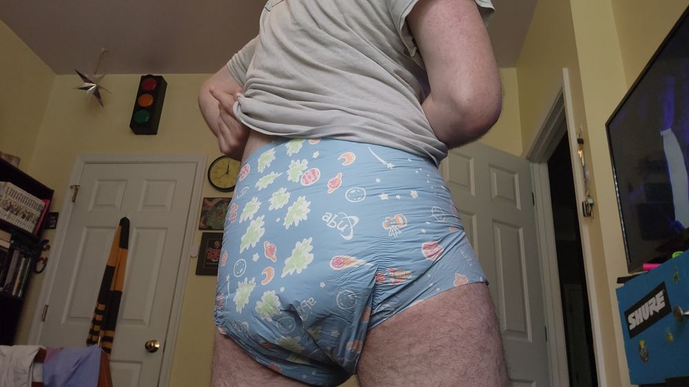 A photo of me wearing an ABU space diaper with my shirt pulled up.