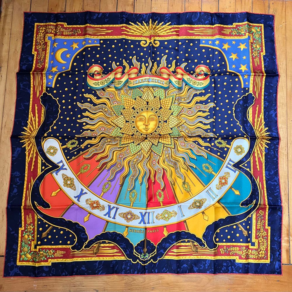 Vintage Hermes scarf featuring a brilliant center sun. 