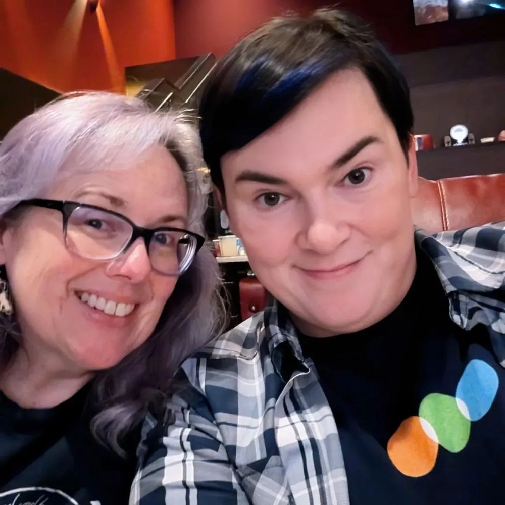 Mona takes a selfie with her spouse Nat before a screening of The Naked Gun (2025).