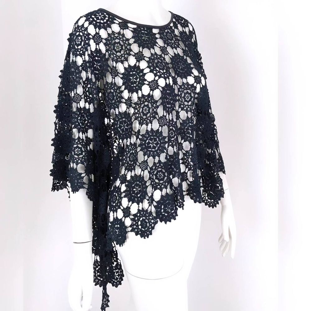A recycled black lace tablecloth made into a chic shawl