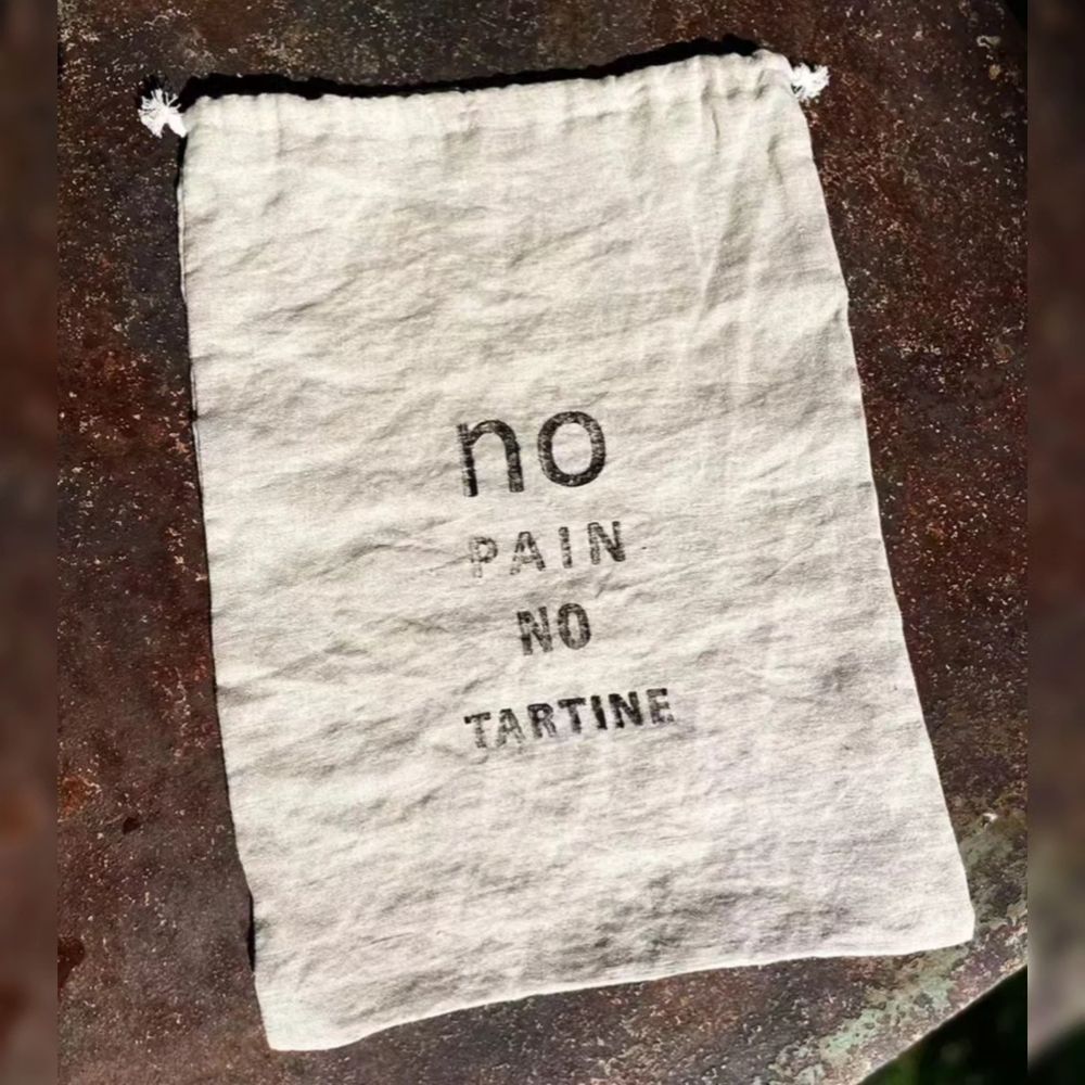 Naturally dyed woven French linen bread bag with drawstring printed with No Pain No Tartine