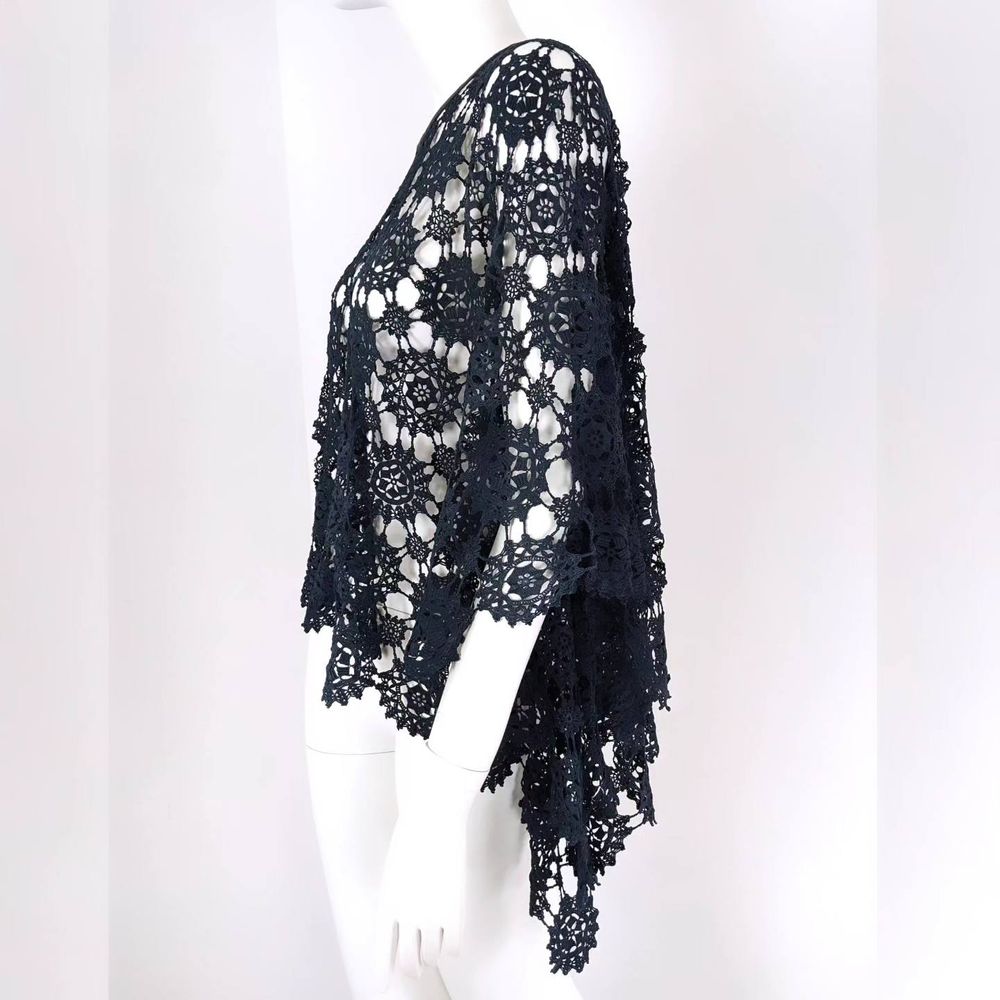 A recycled black lace tablecloth made into a chic shawl
