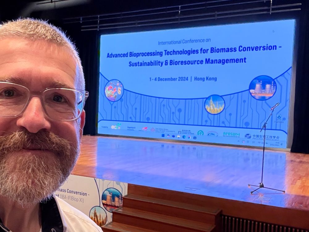 Me in front of the adversement of the International Conference on Advanced Bioprossessing Technologies for Biomass Conversion - Sustainability & Bioresource Management 