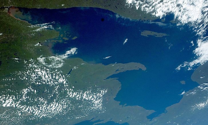 A satellite photo of Lake Superior with some cloud cover